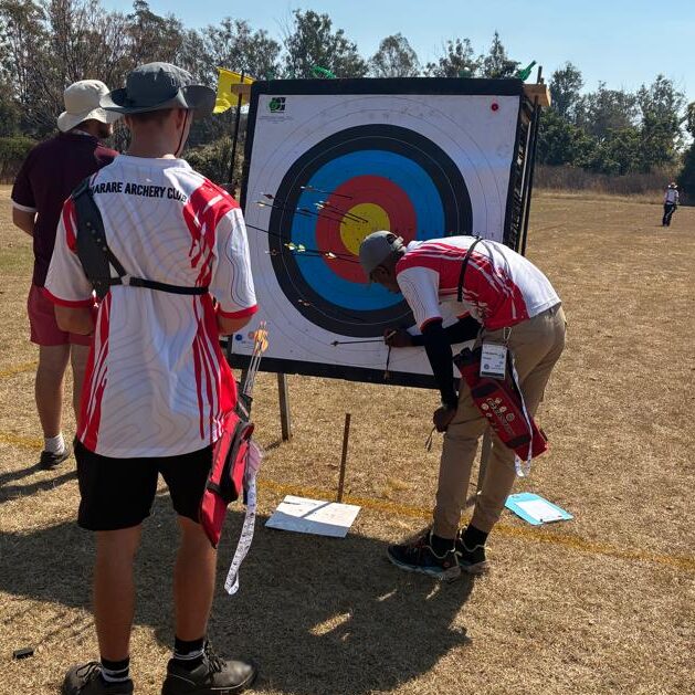 HAC Archers scoring and collecting arrows
